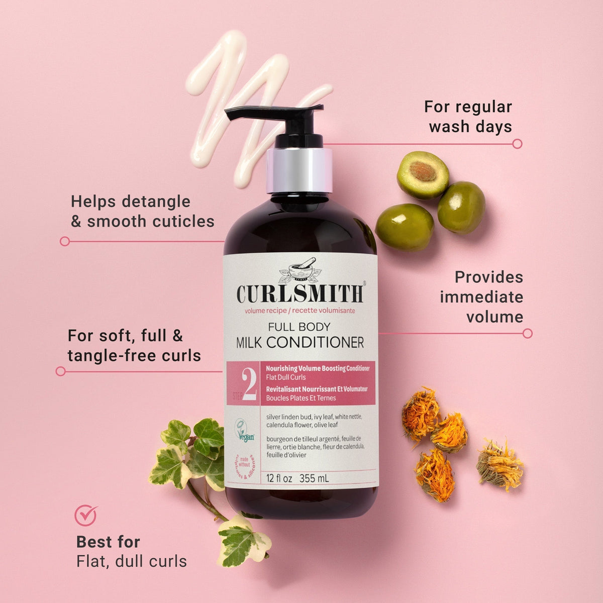 Curlsmith full body milk conditioner bottle with olives and leaves on a pink background