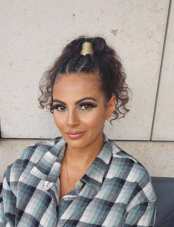 Woman with braids and a ponytail