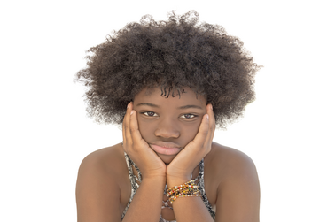 Worried woman with coily hair