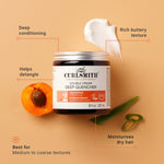 Curlsmith Double Cream Deep Quencher jar with apricot and aloe on a beige background