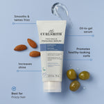Curlsmith Frizz Rescue Finishing Serum tube with ingredients on a blue background