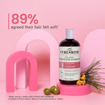 Curlsmith shampoo bottle on a pink background with text about hair softness