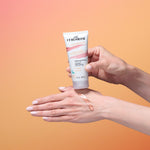 Person applying Curlsmith hair product to their hand against a gradient background