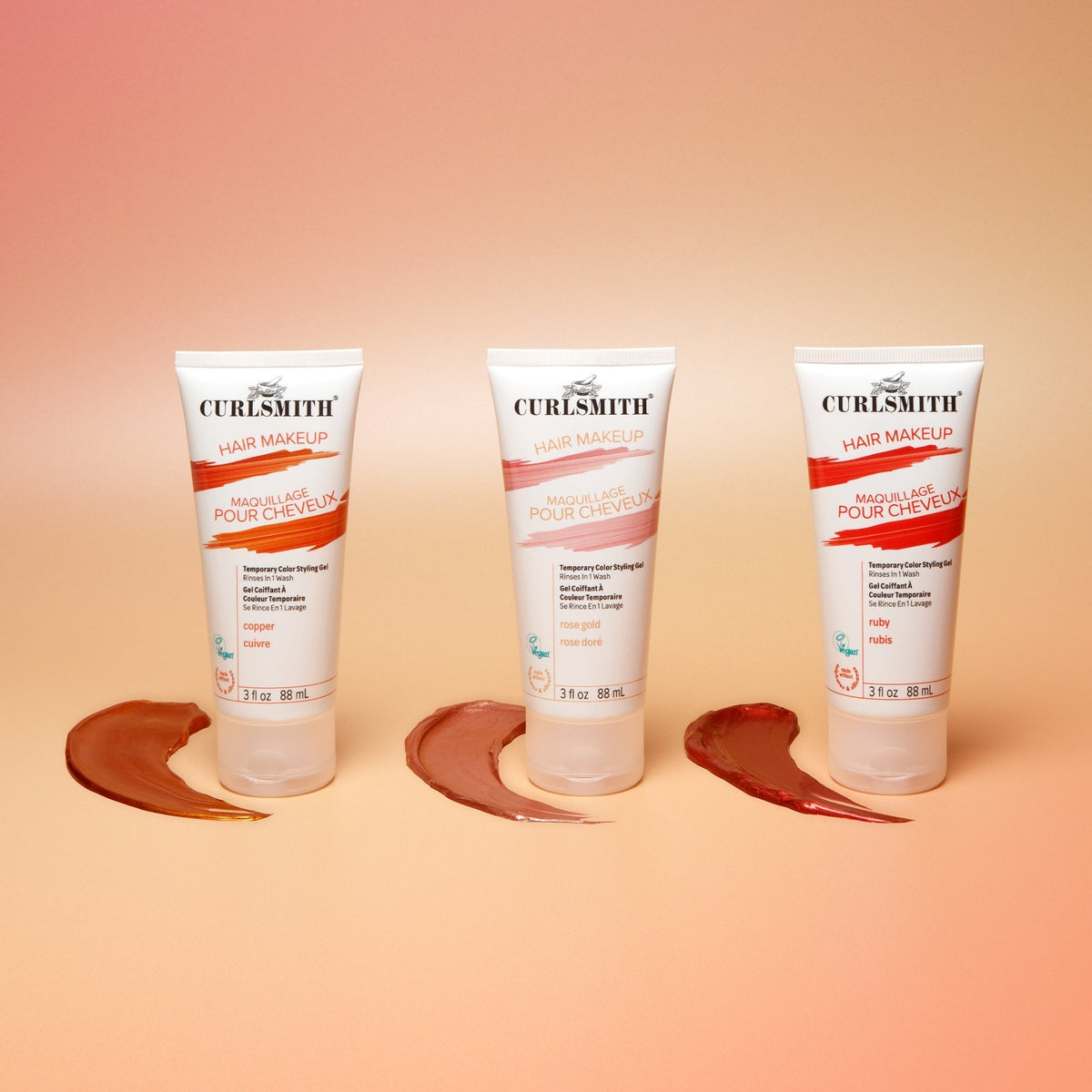 Three bottles of Curlsmith hair makeup on a peach background
