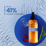 Curlsmith Shake & Shine bottle on a blue circular mat with water droplets and cherry tomatoes.