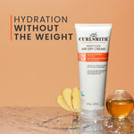 Curlsmith weightless air dry cream tube on a wooden surface with bananas and a glass of water in the background.